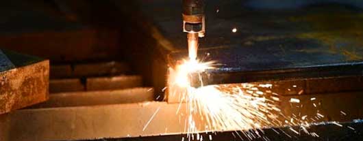 Cutting torch cutting a steel sheet