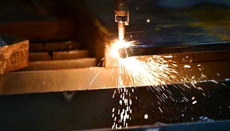 Cutting torch cutting steel beams