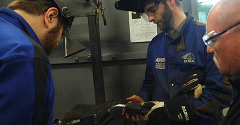 A student learning to TIG weld