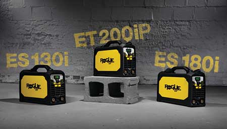 Three ESAB welding machines against a grey brick and concrete background.