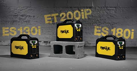 Three ESAB welding machines against a grey brick and concrete background.