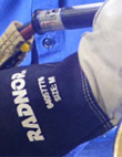 Closeup of RADNOR logo on an industrial glove cuff.
